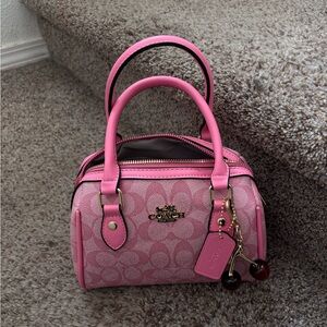 Coach Pink Mini Bag with Signature Design